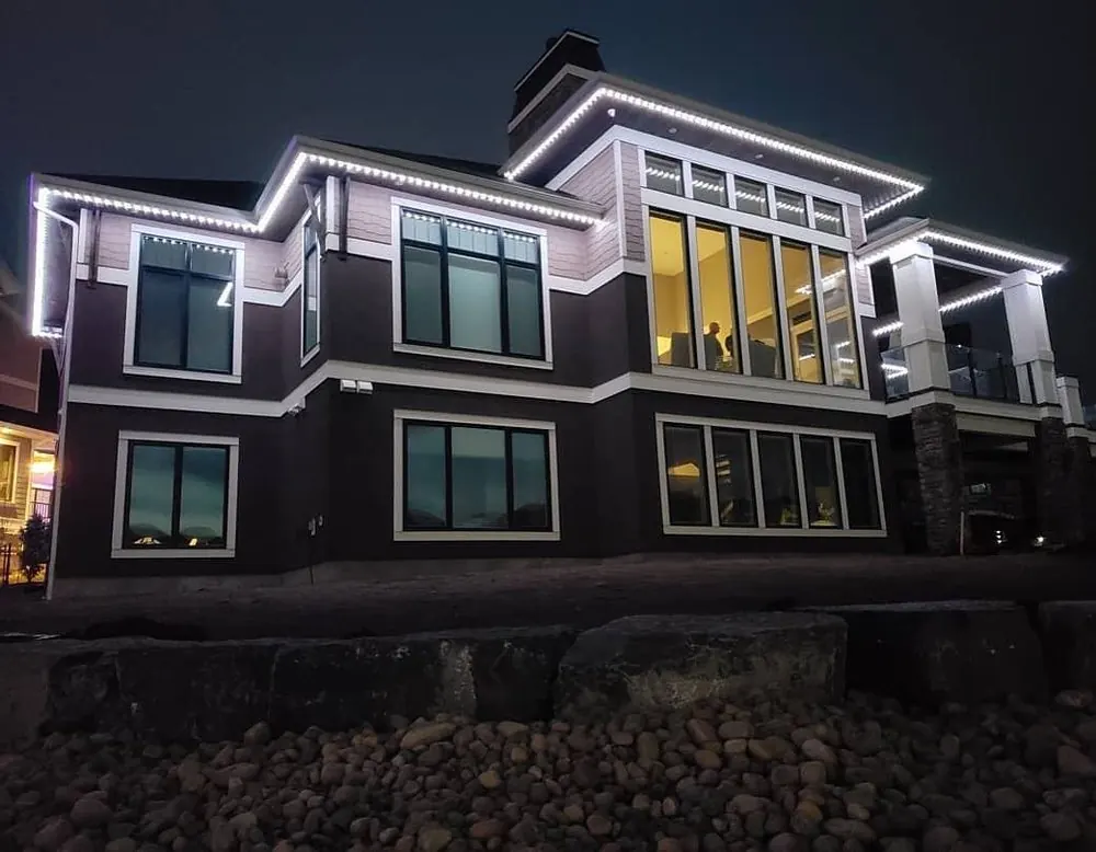 House with permanent lights: Modern home, white accents